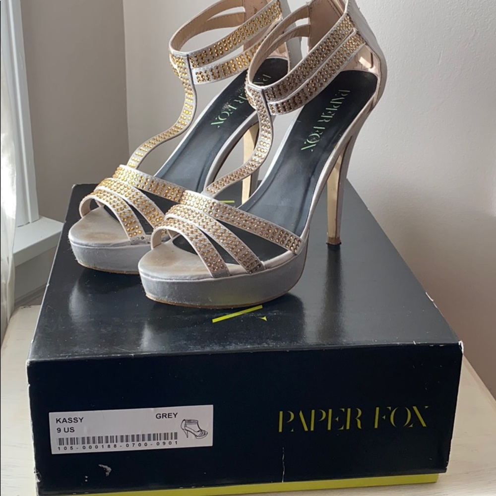 Silver heels with gold rhinestones.